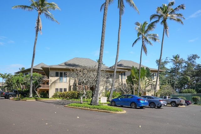 4460 Nehe Rd Unit 203, Lihue, HI 96766 - view of building exterior with uncovered parking