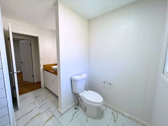 19-4035 Haunani Rd, Volcano, HI 96785 - bathroom with marble look tile flooring, vanity, toilet, and baseboards