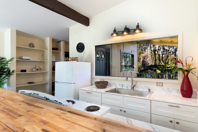 11-3246 Alaula St, Volcano, HI 96785 - kitchen featuring freestanding refrigerator, a sink, beam ceiling, light stone counters, and stove