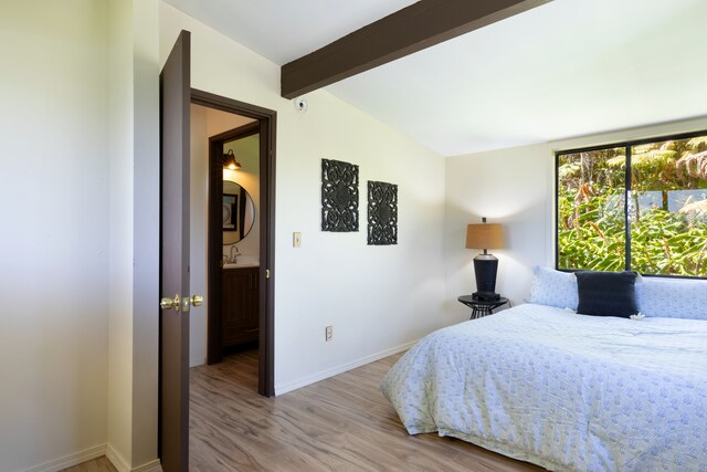 11-3246 Alaula St, Volcano, HI 96785 - bedroom with wood finished floors, a sink, and baseboards