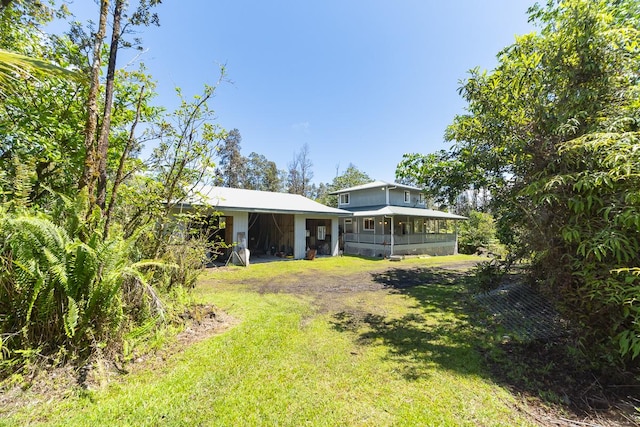16-1366 Ao Rd, Mountain View, HI 96771 - view of green lawn featuring a carport