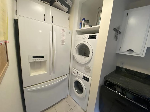 75-6026 Alii Dr Unit 3105, Kailua-Kona, HI 96740 - laundry room with stacked washing machine and dryer and light tile patterned floors