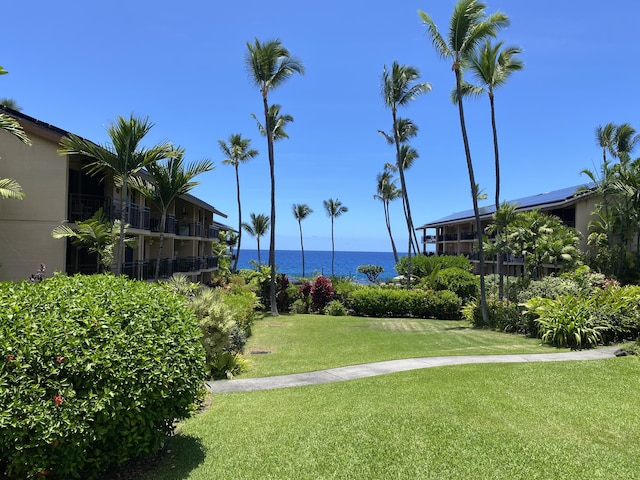 75-6026 Alii Dr Unit 3105, Kailua-Kona, HI 96740 - view of home's community with a water view and a lawn