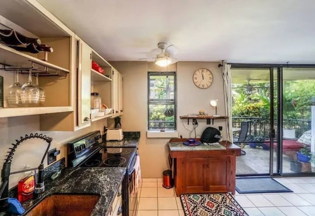 75-6026 Alii Dr Unit 3105, Kailua-Kona, HI 96740 - kitchen featuring black range with electric cooktop, open shelves, a sink, a ceiling fan, and light tile patterned floors