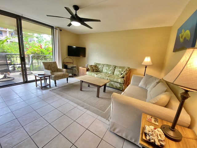 75-6026 Alii Dr Unit 3105, Kailua-Kona, HI 96740 - living area with tile patterned floors, expansive windows, and ceiling fan
