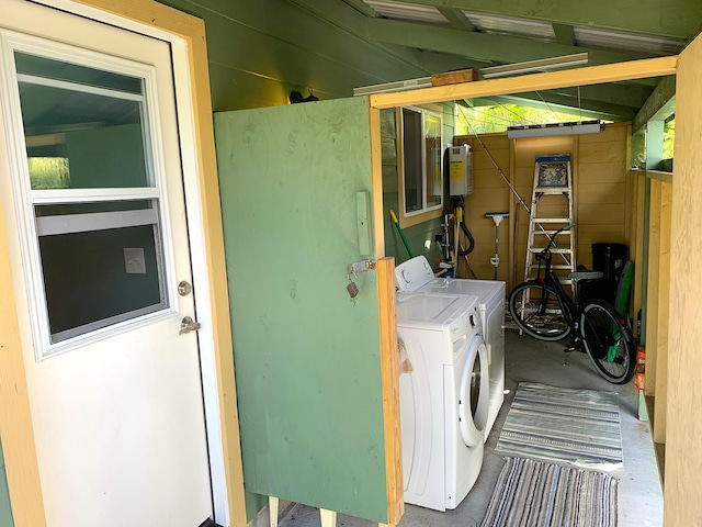 12-311 W Pohakupele Loop, Pahoa, HI 96778 - washroom featuring independent washer and dryer and water heater