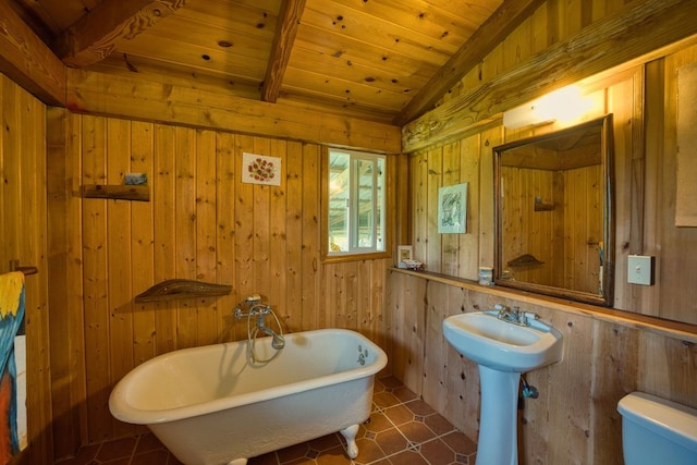 11-2860 Apele Rd, Mountain View, HI 96771 - full bathroom featuring a freestanding bath, wood walls, wood ceiling, toilet, and a sink