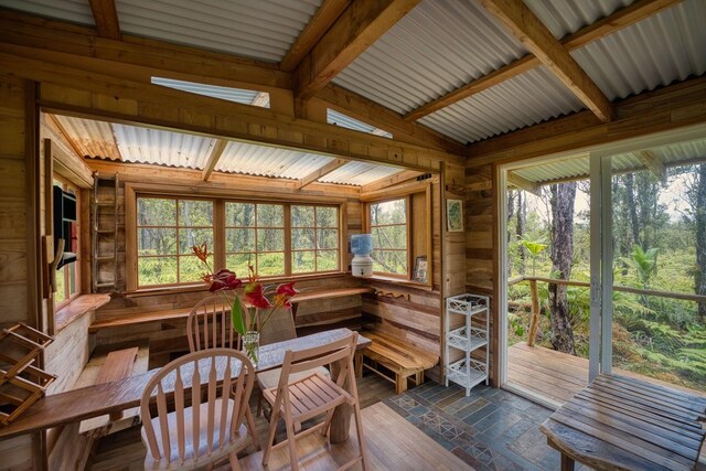 11-2860 Apele Rd, Mountain View, HI 96771 - sunroom with lofted ceiling, wood walls, and a deck