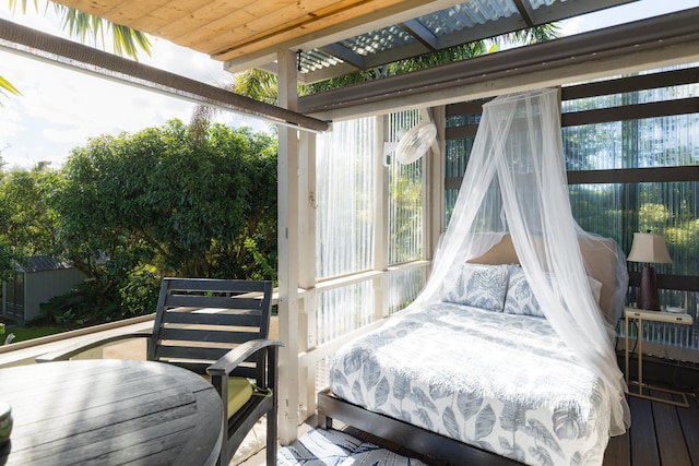 12-7124 Kalapana Kapoho Beach Rd, Pahoa, HI 96778 - bedroom featuring multiple windows and wood finished floors