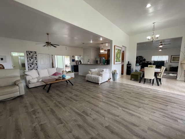 15-1765 28th Ave, Keaau, HI 96749 - living room featuring a chandelier, wood finished floors, a ceiling fan, and lofted ceiling