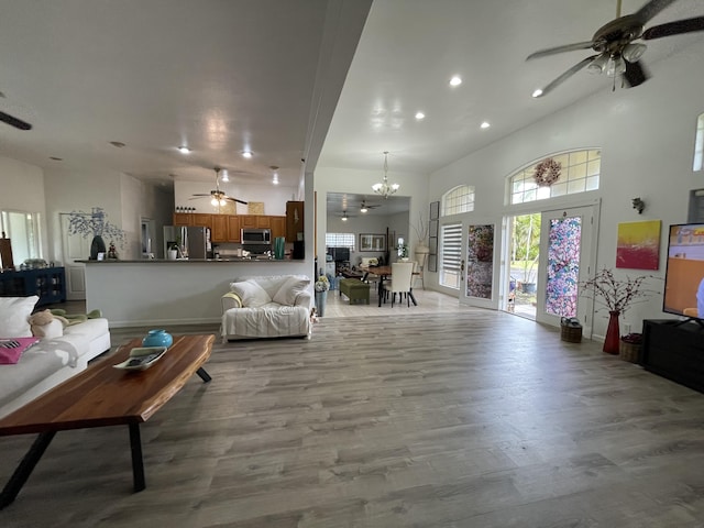15-1765 28th Ave, Keaau, HI 96749 - living room featuring ceiling fan, recessed lighting, a chandelier, wood finished floors, and a high ceiling