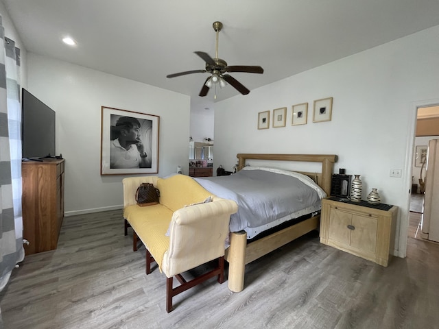 15-1765 28th Ave, Keaau, HI 96749 - bedroom with wood finished floors, baseboards, ceiling fan, refrigerator, and recessed lighting