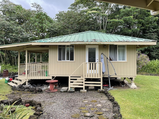 15-1765 28th Ave, Keaau, HI 96749 - view of front facade featuring metal roof and a front yard