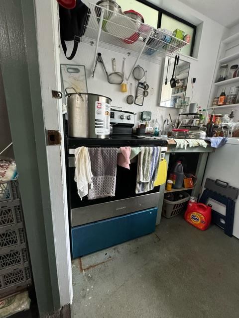 17-7860 Kulani Rd, Mountain View, HI 96771 - kitchen with open shelves and concrete floors