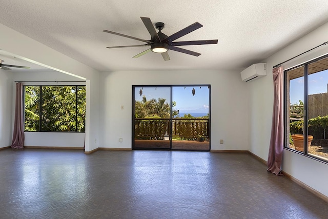 68-3753 Piki Pl, Waikoloa, HI 96738 - empty room featuring an AC wall unit, a ceiling fan, baseboards, tile patterned floors, and a textured ceiling