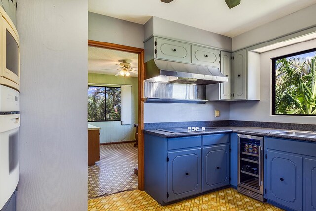 68-3753 Piki Pl, Waikoloa, HI 96738 - kitchen with electric cooktop, wine cooler, light flooring, and dark countertops