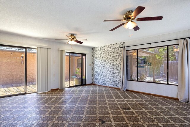 68-3753 Piki Pl, Waikoloa, HI 96738 - spare room with ceiling fan, baseboards, and a textured ceiling