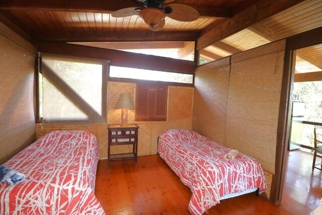 82-6286 Puuhonua Rd, Captain Cook, HI 96704 - bedroom with wood ceiling and wood finished floors