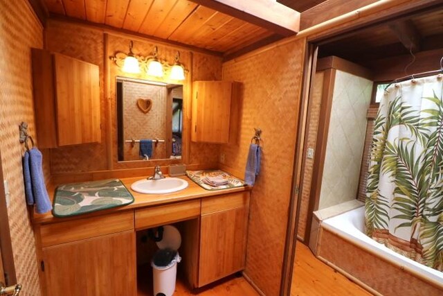 82-6286 Puuhonua Rd, Captain Cook, HI 96704 - full bathroom featuring wood ceiling, wood finished floors, vanity, and shower / bathtub combination with curtain