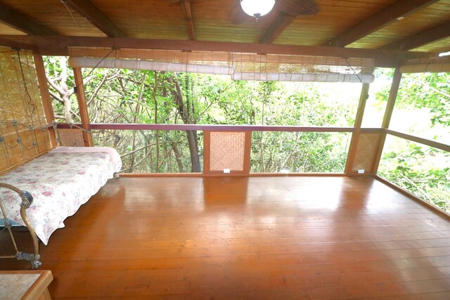 82-6286 Puuhonua Rd, Captain Cook, HI 96704 - bedroom featuring hardwood / wood-style flooring, wood ceiling with exposed beams, and multiple windows