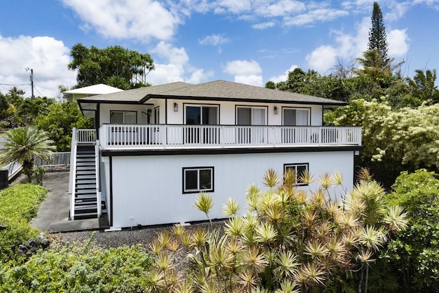 15-112 Kuna St, Pahoa, HI 96778 - rear view of house with stairway and a balcony