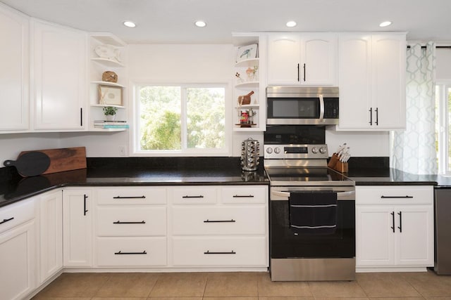 15-112 Kuna St, Pahoa, HI 96778 - kitchen featuring appliances with stainless steel finishes, open shelves, white cabinetry, dark countertops, and recessed lighting
