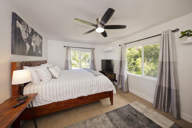 15-112 Kuna St, Pahoa, HI 96778 - bedroom featuring a wall mounted AC, baseboards, and ceiling fan