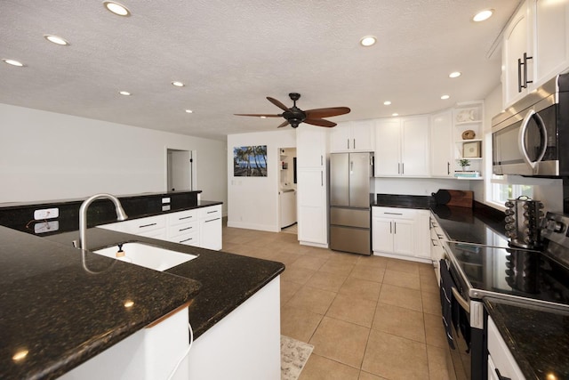 15-112 Kuna St, Pahoa, HI 96778 - kitchen featuring stainless steel appliances, a sink, open shelves, a ceiling fan, and light tile patterned floors