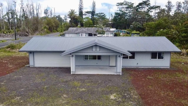16-2142 Kuhio Dr, Pahoa, HI 96778 - back of property with a metal roof and view of scattered trees