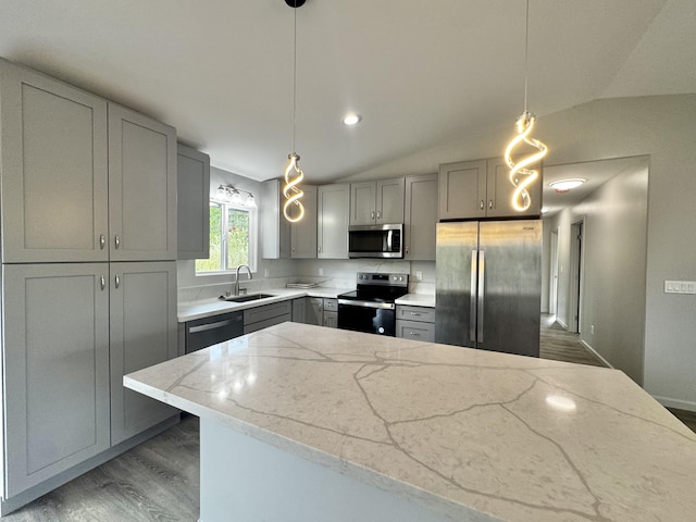 16-2142 Kuhio Dr, Pahoa, HI 96778 - kitchen featuring gray cabinets, appliances with stainless steel finishes, wood finished floors, light stone counters, and lofted ceiling