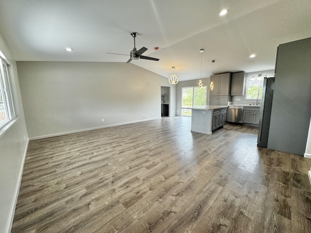 16-2142 Kuhio Dr, Pahoa, HI 96778 - unfurnished living room featuring a ceiling fan, wood finished floors, vaulted ceiling, and recessed lighting