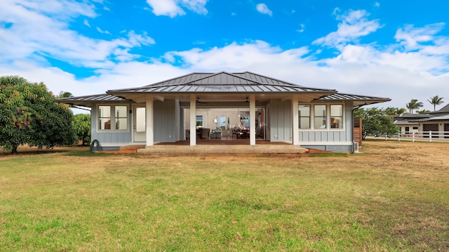 1778 Poipu Aina Pl Unit B, Koloa, HI 96756 - back of property with a standing seam roof, board and batten siding, ceiling fan, metal roof, and a yard