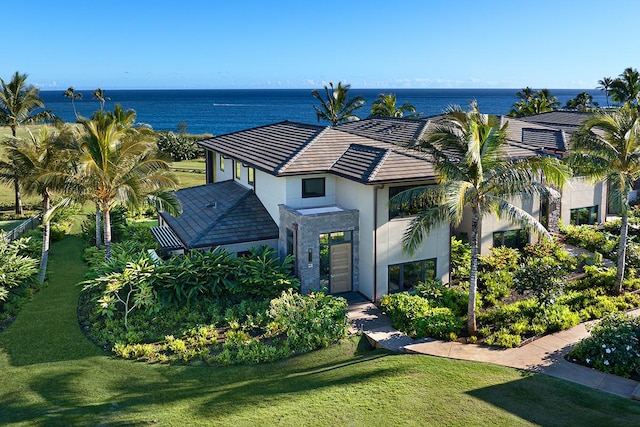 3770 Alaoli Way Unit 2006, Lihue, HI 96766 - view of front of property featuring stucco siding, a front lawn, and a water view
