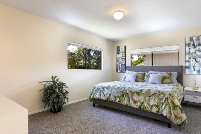 99-7715 Kalehua Pl, Volcano, HI 96778 - bedroom featuring carpet floors and baseboards