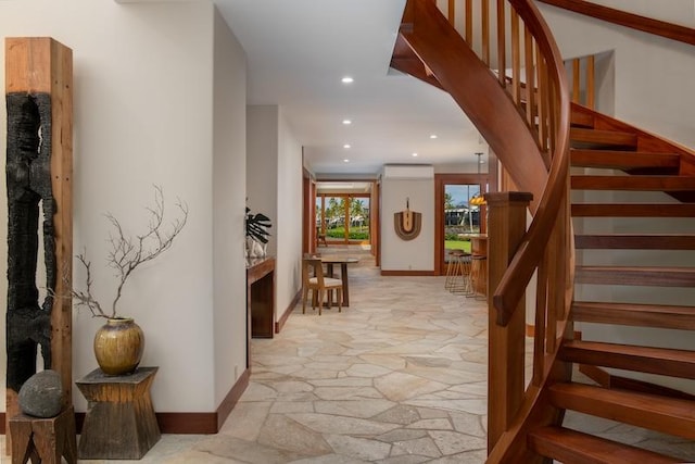 68-1051 Honokaope Way, Kamuela, HI 96743 - stairs featuring stone floors, recessed lighting, a wall mounted air conditioner, and baseboards