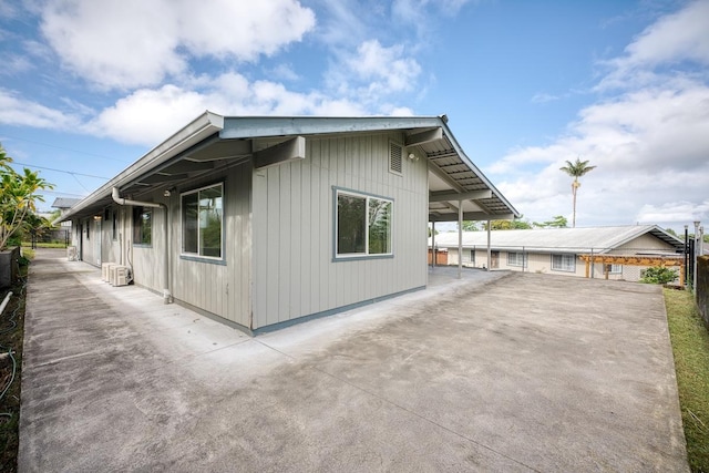 103 Puhili St, Hilo, HI 96720 - view of property exterior with a patio area and driveway
