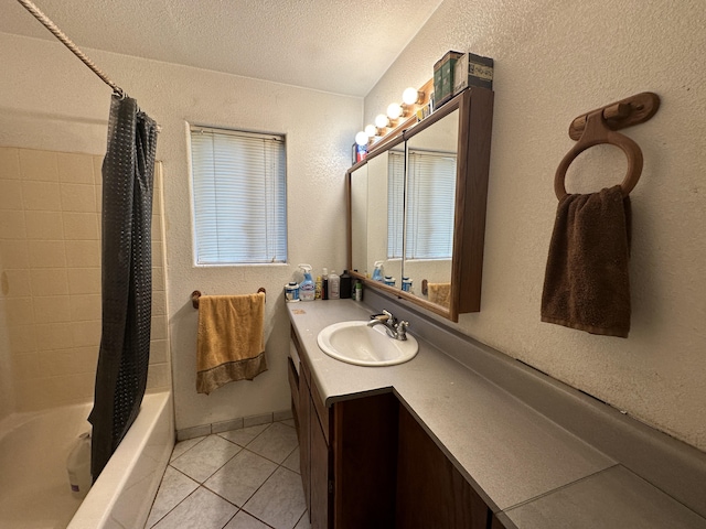 16-1909 36th Ave, Keaau, HI 96749 - bathroom featuring tile patterned floors, vanity, shower / bath combo with shower curtain, a textured wall, and a textured ceiling