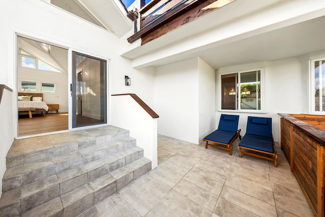 5111 Weke Rd, Hanalei, HI 96714 - doorway to property featuring stucco siding and a patio
