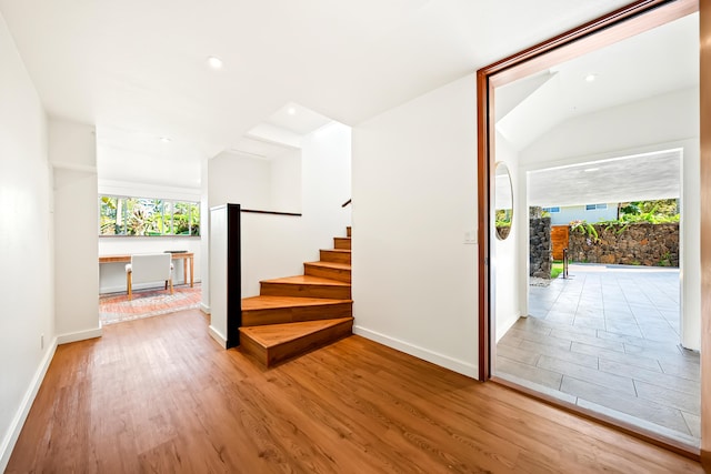 5111 Weke Rd, Hanalei, HI 96714 - stairway with wood finished floors, baseboards, and recessed lighting