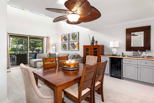 68-1122 Na Ala Hele Rd Unit Q23, Kamuela, HI 96743 - dining room with beverage cooler, light carpet, ceiling fan, ornamental molding, and bar