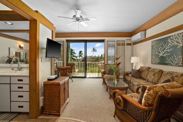 2253 Poipu Rd Unit 312, Koloa, HI 96756 - carpeted living room with a sink, a wall unit AC, and a ceiling fan