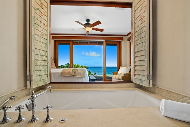 1871 Pee Rd Unit 1, Koloa, HI 96756 - bathroom with a bath, a water view, and ceiling fan