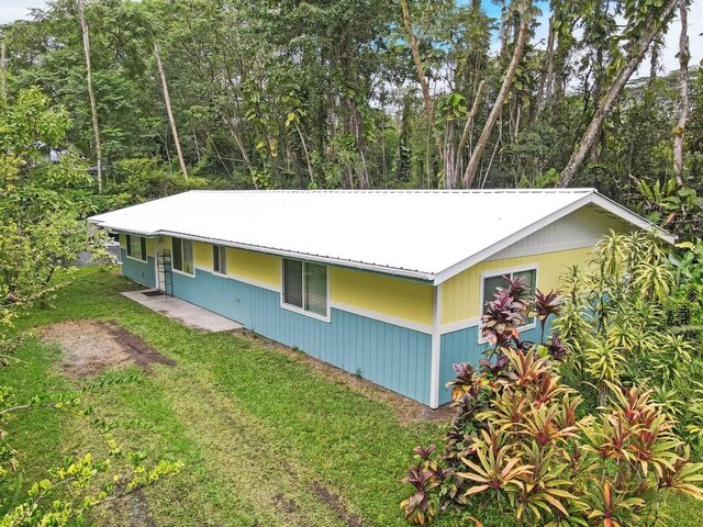 14-3556 Seadrift Rd, Pahoa, HI 96778 - view of side of property featuring metal roof and a yard