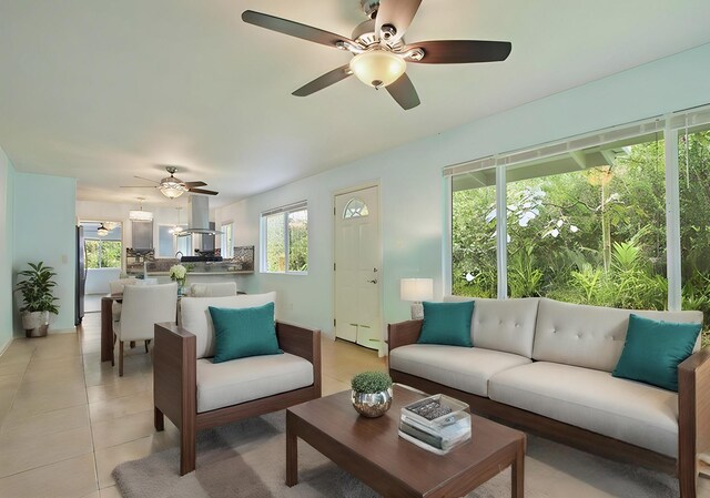 14-3556 Seadrift Rd, Pahoa, HI 96778 - living area with ceiling fan, light tile patterned floors, and baseboards