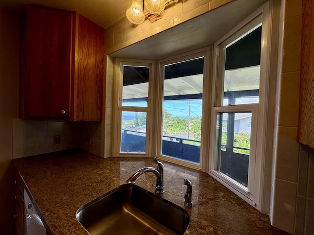 74-5075 Kau Pl, Kailua-Kona, HI 96740 - kitchen featuring a sink and dark stone counters