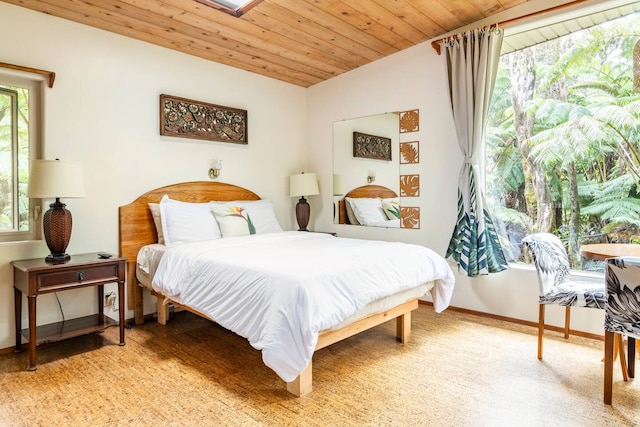 11-3828 2nd St, Volcano, HI 96785 - bedroom featuring baseboards, wooden ceiling, and light wood finished floors