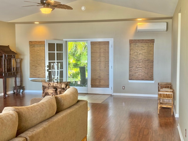 76-149 Kamehamalu St, Kailua-Kona, HI 96740 - living room with a wall unit AC, lofted ceiling, wood finished floors, ceiling fan, and baseboards