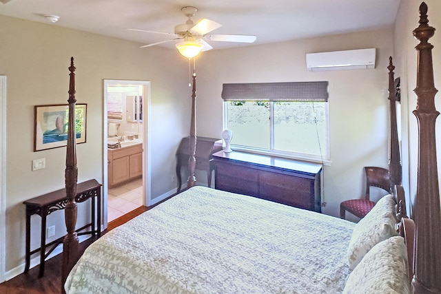76-149 Kamehamalu St, Kailua-Kona, HI 96740 - bedroom with an AC wall unit, wood finished floors, connected bathroom, ceiling fan, and baseboards