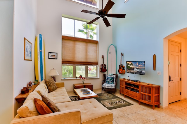 68-1125 Kaniku Dr Unit 706, Kamuela, HI 96743 - living area featuring a high ceiling, arched walkways, a ceiling fan, and tile patterned floors