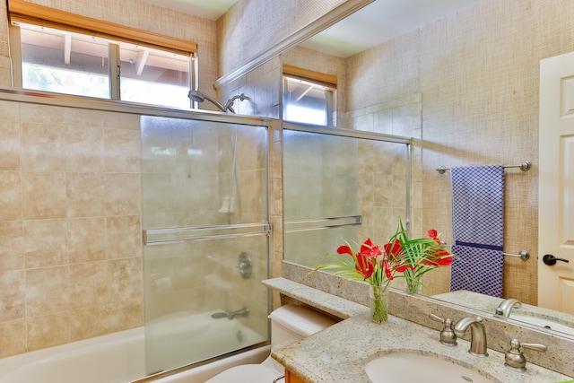 68-1125 Kaniku Dr Unit 706, Kamuela, HI 96743 - bathroom with vanity, enclosed tub / shower combo, and toilet